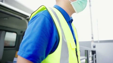 Parcel staff arranges parcels on the car and deliver them to the customer at the Stockbeeldmateriaal 149805065