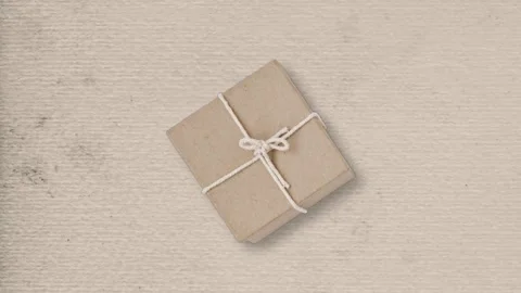 Parcel tied with rope on paper 스톡 동영상 253396455