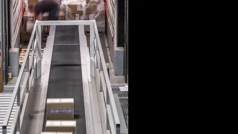 Parcel trailer unloading to conveyor belts Stock Footage 82747069