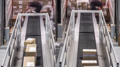 Parcel trailer unloading to conveyor belts Stock Footage 82747379