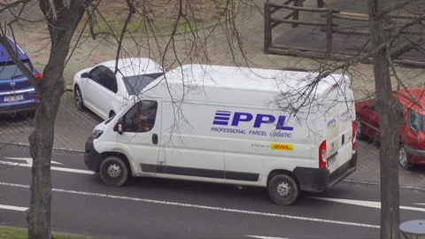 Parcel van of PPL transportation and delivery company, driver gets into the car Stockbeeldmateriaal 313938290