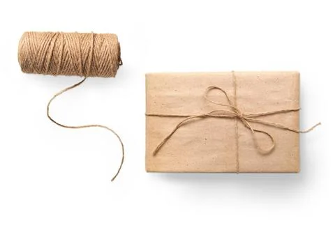 Parcel wrapped packaged box gift and rope isolated on white background 写真素材
