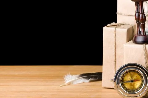 Parcel wrapped packaged box isolated on black Stock Photos