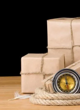 Parcel wrapped packaged box isolated on black Foto stock