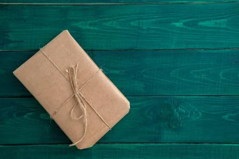 Parcel,gift Packed in eco-friendly paper on dark green wooden background. the 스톡 사진