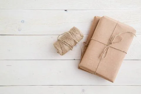 Parcel,gift Packed in eco-friendly paper and twine for packing on light wo... Stock Photos