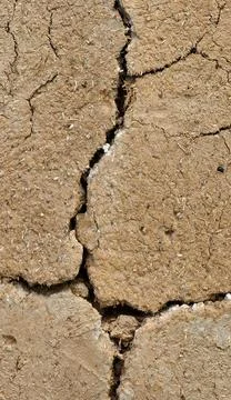 Parched Earth: Closeup of Cracked Mud Symbolizing Drough Stock Photos