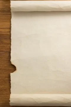 Parchment scroll on wood Fotos de archivo