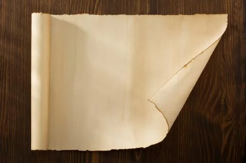 Parchment scroll on wood Stock Photos