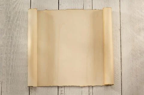 Parchment scroll on wood Stock Photos