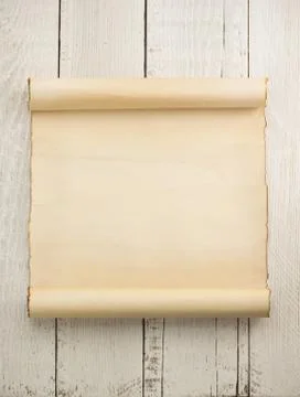 Parchment scroll on wood Stock Photos