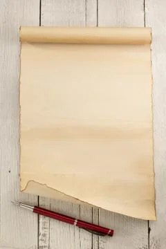 Parchment scroll on wood Stock Photos