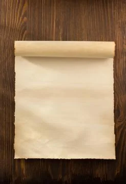Parchment scroll on wood 스톡 사진