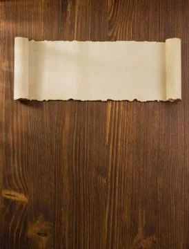 Parchment scroll on wood Stock Photos