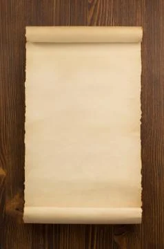 Parchment scroll on wood Stock Photos