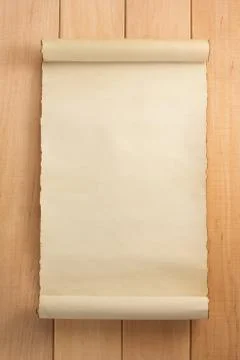 Parchment scroll on wood 스톡 사진