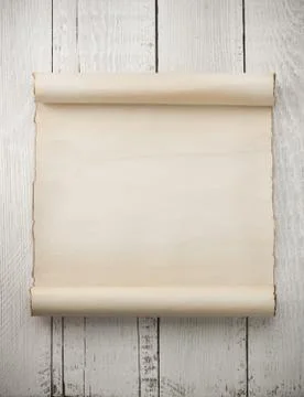 Parchment scroll on wood Stock Photos