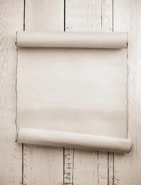 Parchment scroll on wood Stock Photos