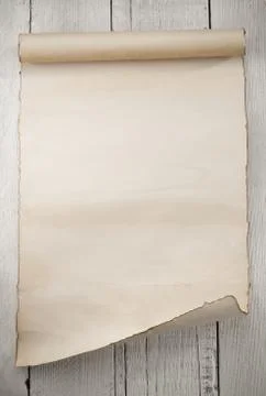 Parchment scroll on wood Fotos de archivo