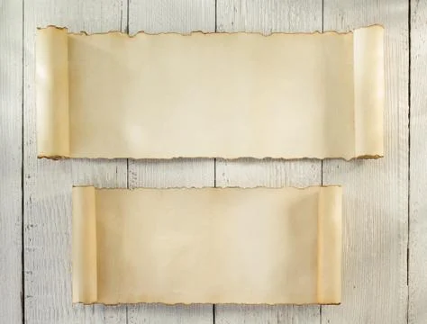 Parchment scroll on wood Stock Photos