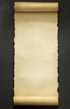 Parchment scroll on wood Fotos de archivo