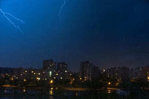 Pardubice - danger flash on panel building in night with drops on window Stock Photos
