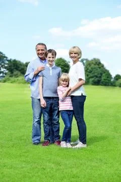 Parenst with chidren is having fun in the park Stock Photos