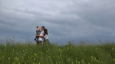 Parent and child stand on spring hill, mother and child play hide and seek 4K Stock Footage 46221493