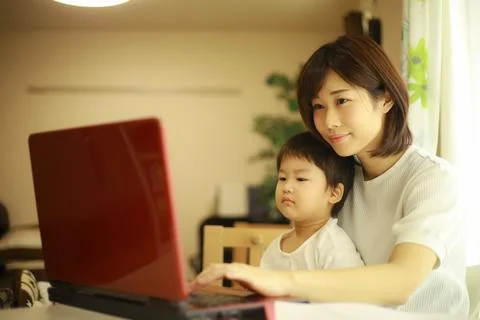 Parent and child using a computer Stock Photos
