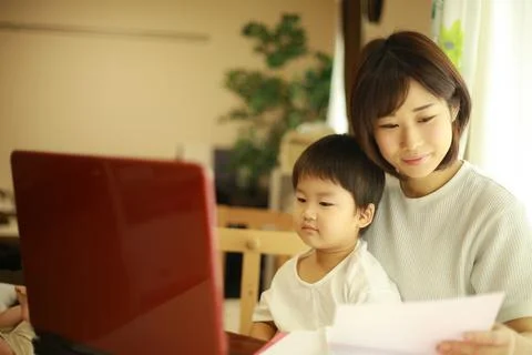 Parent and child using a computer Stock Photos
