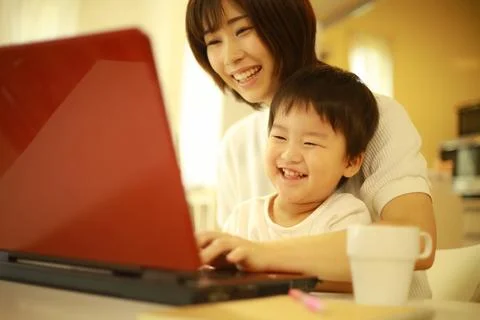 Parent and child using a computer Stock Photos