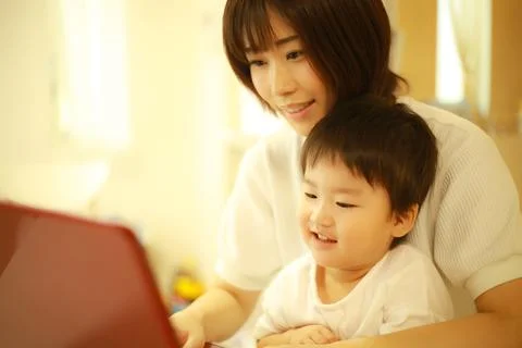 Parent and child using a computer Stock Photos
