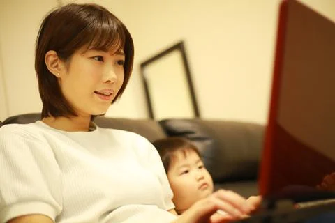 Parent and child using a computer Stock Photos