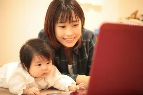 Parent and child using a computer Stock Photos