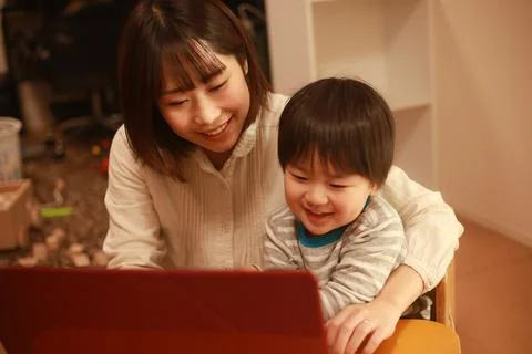 Parent and child using a computer Stock Photos