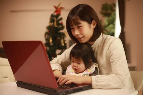 Parent and child using a computer Stock Photos