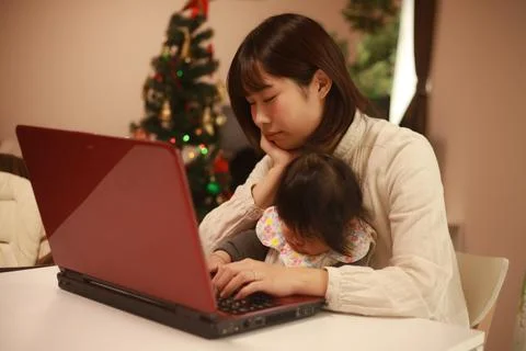 Parent and child using a computer Stock Photos