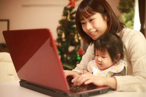 Parent and child using a computer Stock Photos