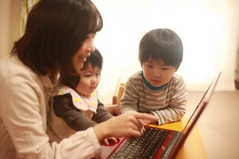 Parent and child using a computer Stock Photos