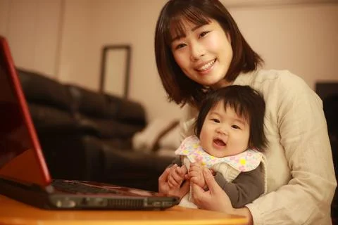 Parent and child using a computer Stock Photos