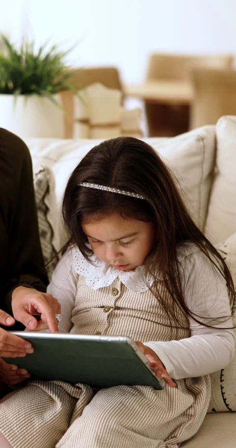 Parent, child and tablet with game on sofa for problem solving, development or Stock Footage 337689877