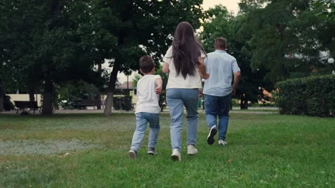 Parent child running park, three people, happy people playing run outdoor Stock Footage 303078572