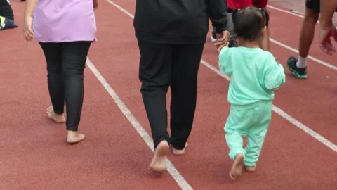 Parent Children Holding Hands Walking Barefoot Stock Footage 243138979