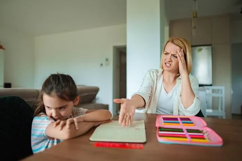 Parent frustrated during quiet study time Stock Photos