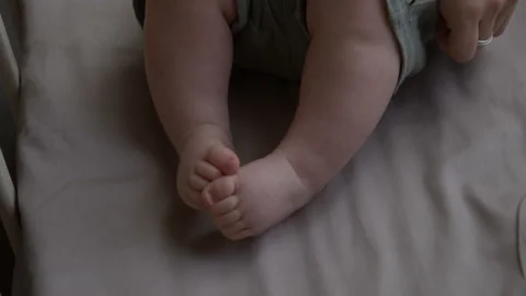 Parent Gently Caressing Happy Baby Lying in Crib at Home Vídeos de archivo 346600181