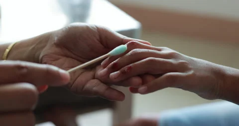 Parent helping her child perform first aid finger injury. Stock Footage 288848459