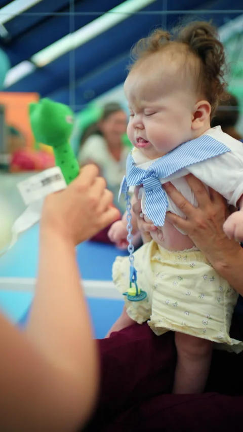Parent keeping child safe and entertained, fostering development and emotional Stock-Footage 342876881