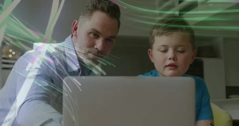 Parent leaning in and pointing at laptop, child learning while animated light Stock Footage 334182349