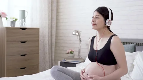 Parent is nodding head slightly with the melody Video stock 147622879