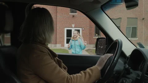 A parent picks up his child from school Stock Footage 205597441